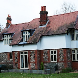 Red brick house with replacement timber windows, Norfolk