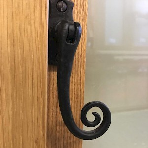 timber windows with ornate fixtures.