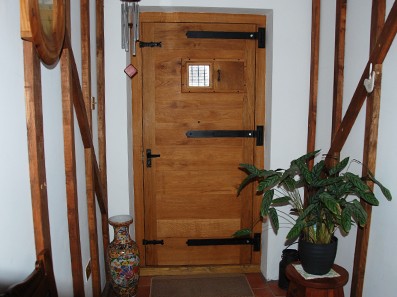 Oak Beams and doors in hallway at Old Flint Barn, Norfolk