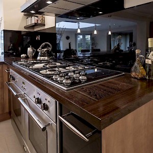 Dark wood kitchen units.